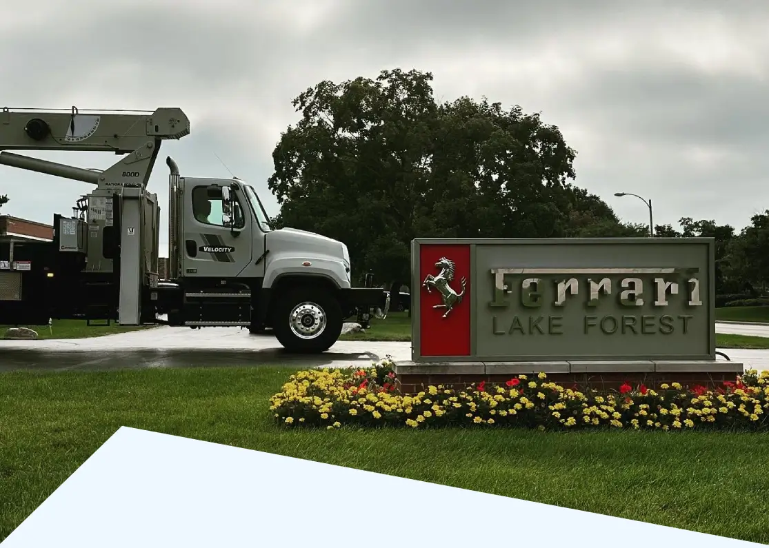 Ferrari Lake Forest sign by utility truck