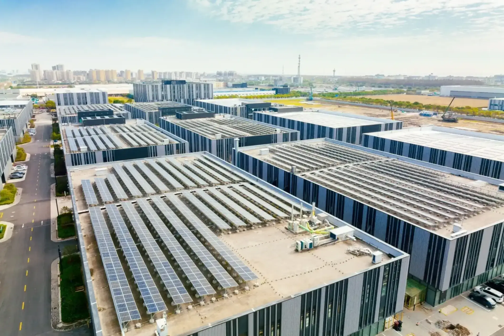 Aerial view of warehouses with rooftop solar panels